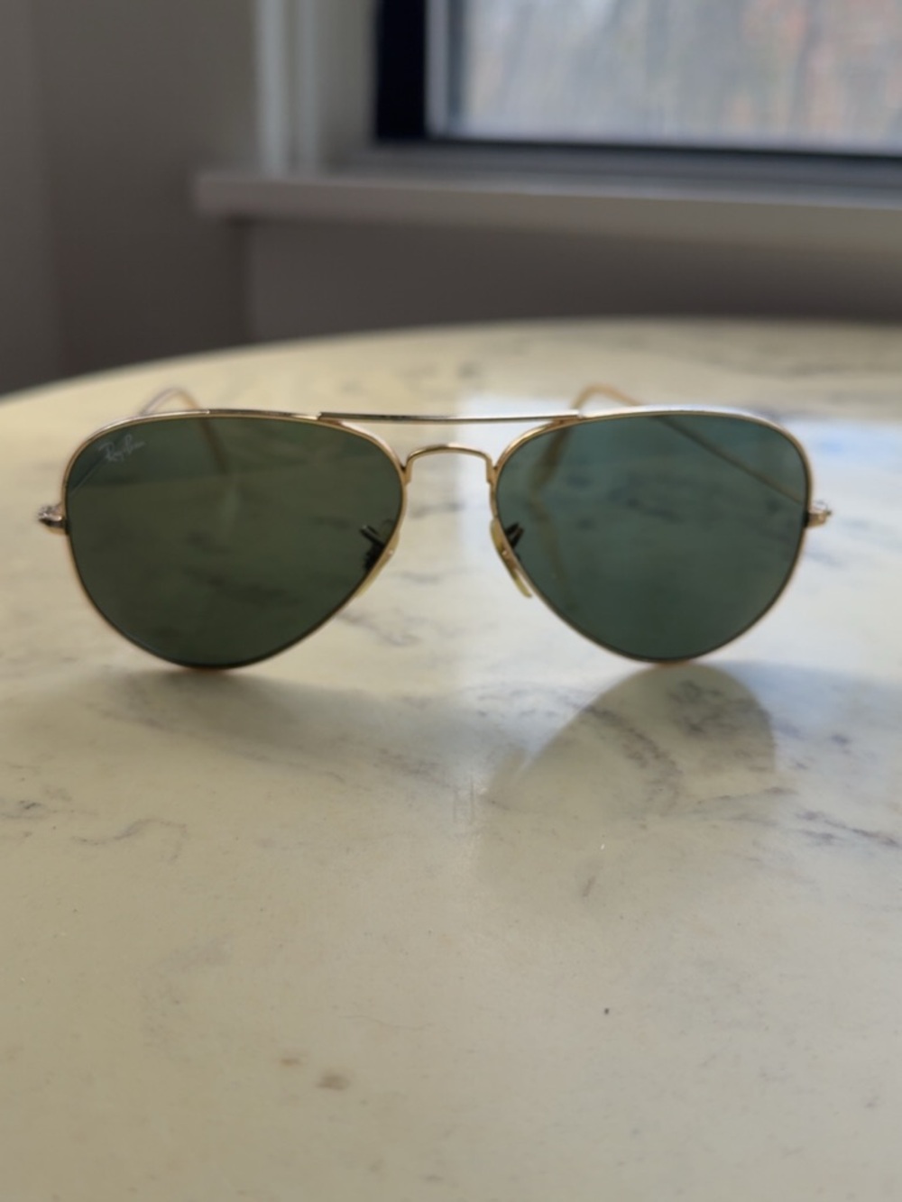 Gold and green Rayban aviators